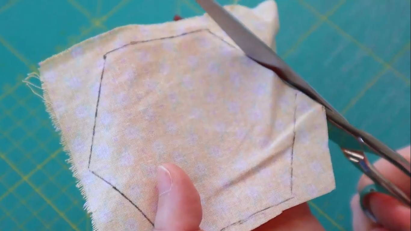 How to Quilt a Hexagon Quilt Top for Beginners: step 2 cut the hexagons