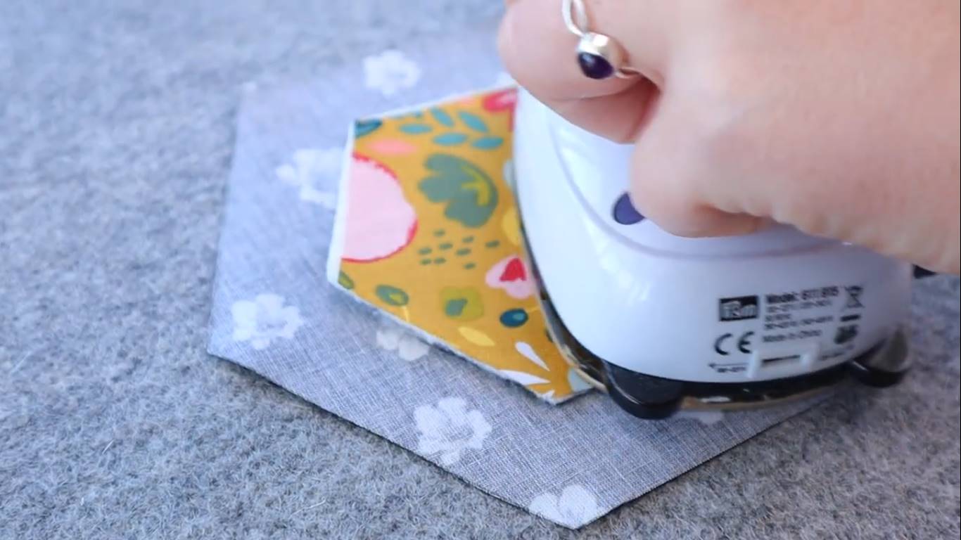 How to Quilt a Hexagon Quilt Top for Beginners step 6 press the quilt sandwiches