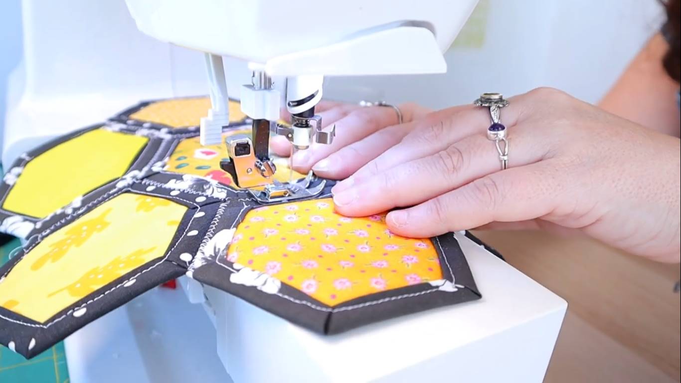 How to Quilt a Hexagon Quilt Top for Beginners step 9 sew the hexies together