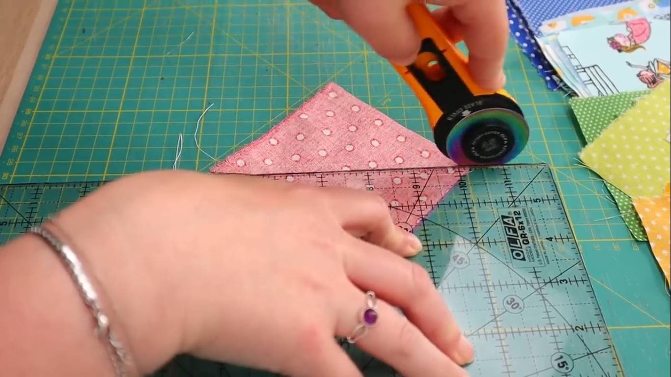 rainbow quilt step 6 cutting the half square triangles