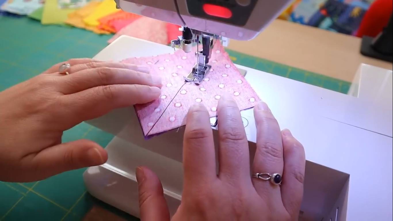 rainbow quilt step 5 sewing the half square triangles