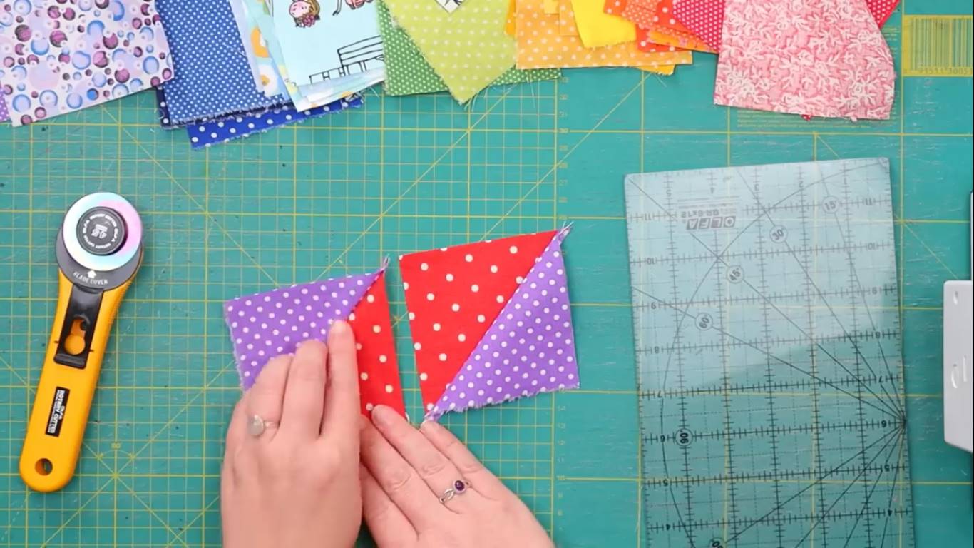 rainbow quilt step 7 trimming the half square triangles