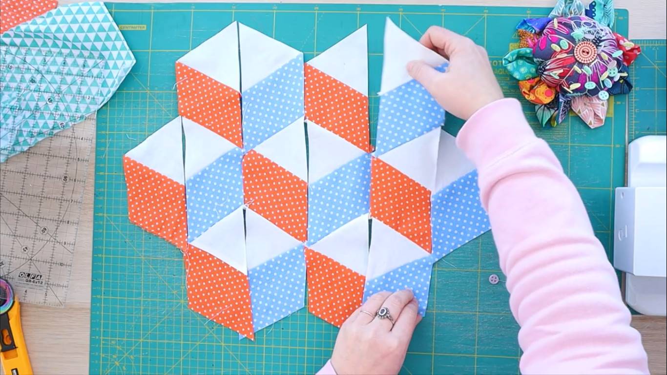 how to make a tumbling quilt block step 9 sew the strips together